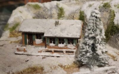 Remplacement de la couleur de la montagne au chalet et son décor enneigé.